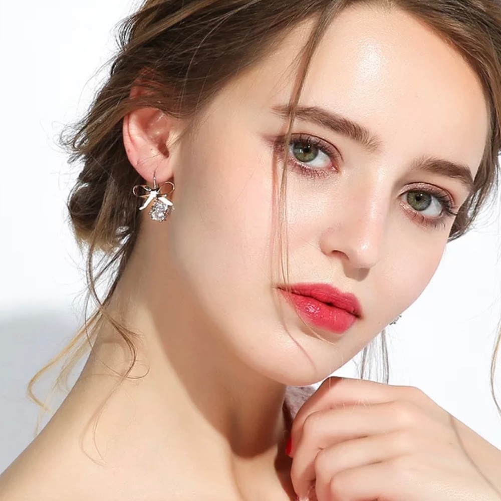 3/$30 Silver Bow Drop Earrings - Picture 4 of 8